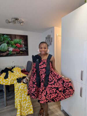 2026/08/1001652280-scaled.jpg Adanna Ankara Pink and Black Bow Dress